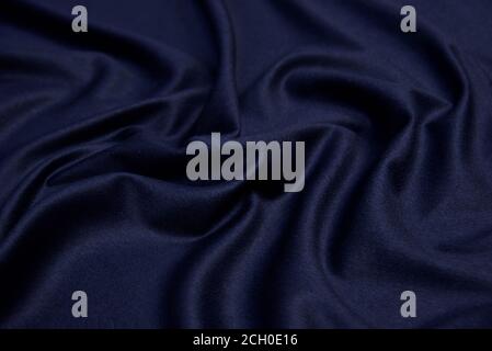 Dark blue wool for coat. Close up texture of the fabric is useful as a background. Stock Photo