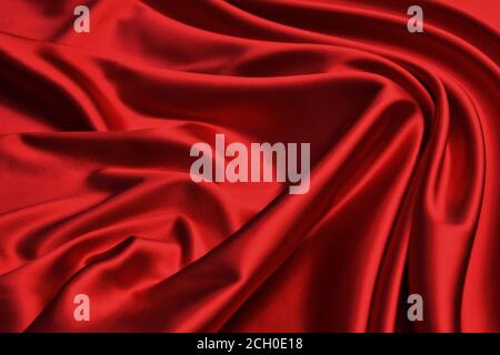Luxury red satin smooth fabric background for celebration, ceremony, event invitation card or advertising poster Stock Photo