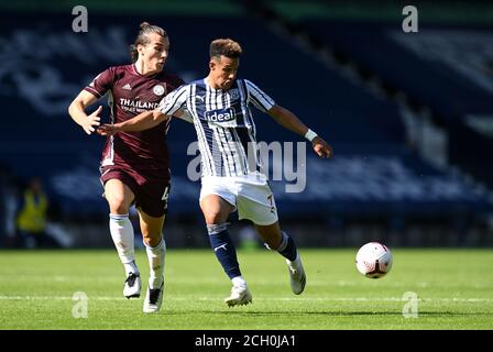 Leicester City's Caglar Soyuncu (left) and West Bromwich Albion's Callum Robinson battle for the ball during the Premier League match at The Hawthorns, West Bromwich. Stock Photo