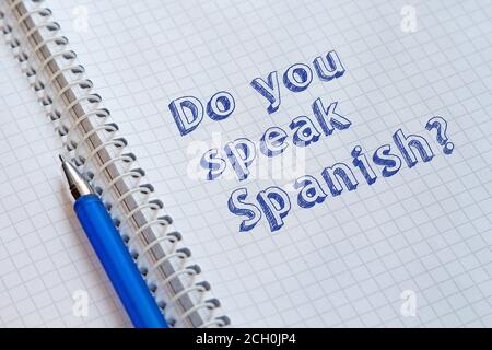 Do you speak Spanish? Text handwritten on sheet of notebook Stock Photo