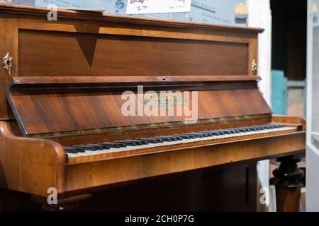 Henry Ward wooden grand piano, vintage old on display in museum in Aldershot, UK Stock Photo