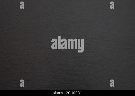 Black Slate Texture, Black stone background. Dark gray grunge banner. Mountain texture. Close-up. Volumetric. The rocky backdrop. Abstract black rock Stock Photo