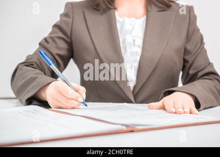 Businesswoman clerk office worker signing Documents, contract, making a deal, Office business concept Stock Photo
