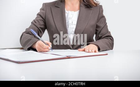 Businesswoman clerk office worker signing Documents, contract, making a deal, Office concept Stock Photo