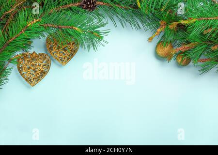 Christmas decoration with holly, seasonal background for greeting cards. New year concept. Fir branches and gift boxes, stars and pine. Stock Photo