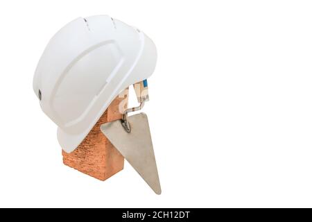 Bricklayer tools. Mason tools - Trowel, bricks and white helmet isolated on white background Stock Photo