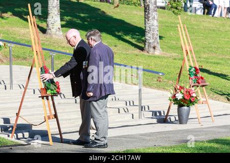 Anzac Day services in Tauranga, New Zealand. Two elderly veterans lay a wreath in Memorial Park. April 25 2018 Stock Photo