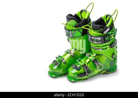 Ski boots isolated on white background. Modern, green ski boots. Pair of ski boots isolated on white background. hardness index 130 Stock Photo