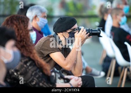 Man photographing with black face mask. Stock Photo