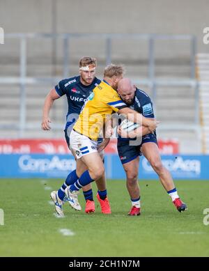 Sale, UK. 13th September 2020; AJ Bell Stadium, Salford, Lancashire, England; English Premiership Rugby, Sale Sharks versus Bath; Jake Cooper-Woolley of Sale Sharks tackled by Bath Credit: Action Plus Sports Images/Alamy Live News Stock Photo