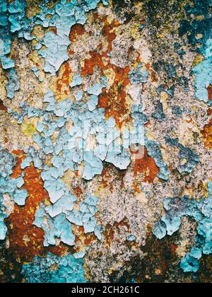 background old concrete wall with cracked peeling  paint, texture, multicolored Stock Photo