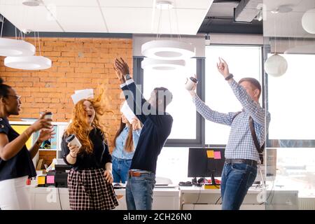 co-workers are celebrating successful contract of the firm.good deal. when business is growing fast. Stock Photo