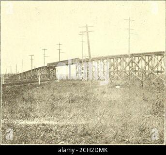 . Electric railway journal . Mesaba Railway—Typical Way Shelter sembles an ordinary hexagon nut, except that it istapped out only on one side to fit over the head ofthe l^-in. ground pipe. A horizontal slot is cut inthe cap 7/16 in. below the top, and a tapered holeslightly off center is drilled from the top of the capthrough this slot. The depth of the slot and the loca-tion of the tapered hole are such as to leave sufficientspace between the inside edge of the slot and the hole. Mesaba Railway—Combination Wooden Trestle Approachesto Steel (iirder Bridge at Kinross to wedge securely the groun Stock Photo