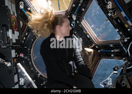 ISS - 2016 - NASA astronaut Kate Rubins in front of the windows in the International Space Station’s cupola module during Expedition 49 in 2016 - Phot Stock Photo