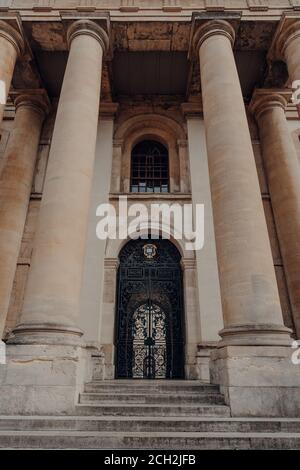 Oxford, UK - August 04, 2020: Low angle view of the entrance to the Clarendon Building, an early 18th-century neoclassical building of the University