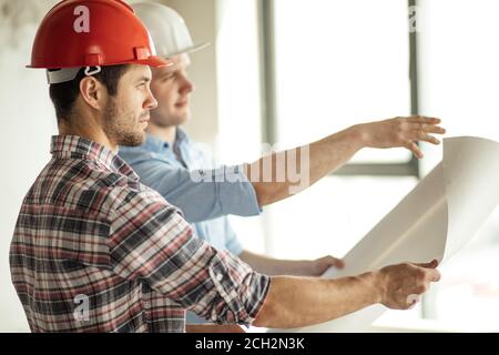 two talented architects are trying to improve the city life. close up side view photo Stock Photo