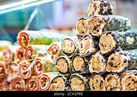 Various bright colored turkish delights sweets baklava lokum and dried fruits vegetables on market in Istanbul, Turkey Stock Photo