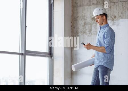 constructor is sending a message to a client. side view photo Stock Photo
