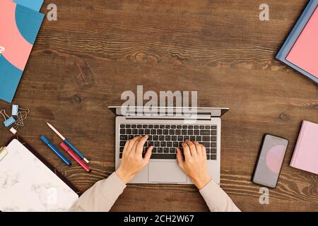 Top view of hands of young contemporary designer or other specialist typing Stock Photo