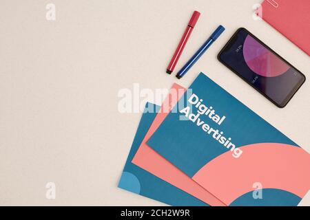 Flat layout of digital advertising brochures and phone with financial diagram Stock Photo