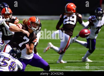 Cleveland Browns punter Jamie Gillan (7) gets stripped of the ball while  faking a punt as Baltimore Ravens linebacker L.J. Fort (58) and linebacker  Otaro Alaka (50) recover the fumble during the