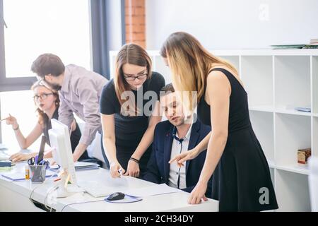 closeup portrait of female office workers persuading their leader to sign the contract at workplace Stock Photo