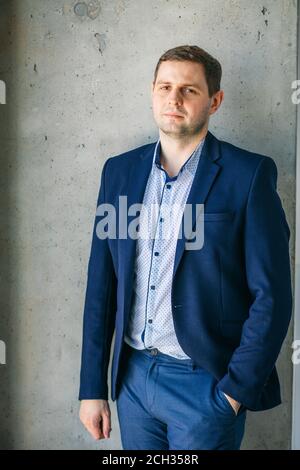 closeup image of stylish male in formal clothes putting his hand on the pocket Stock Photo
