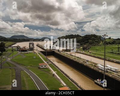 City of Knowledge, Panama - November 30, 2008: Miraflores locks. View to Pacific Ocean from the locks under cloudscape and green mountains on horizon. Stock Photo
