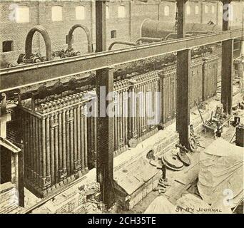 . The Street railway journal . STREET RAILWAY JOURNAL. [Vol. XIL . No. i. torn of the rail, together with the space on each side, isfilled up to the bottom of the pavement with grouting,composed of one part Portland cement, one of sand andthree of clean fine gravel. The rails are bound together. Stock Photo