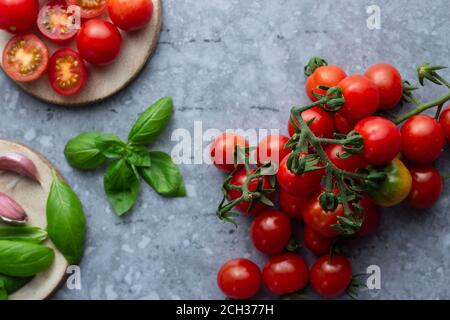 Cherry tomatoes with basil and garlic Stock Photo