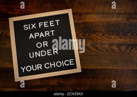 Six Feet Apart or Under  message with Copy Space Stock Photo