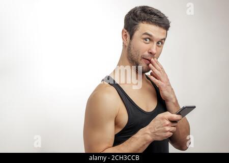 young man has found a secret sms of his wife's phone. side view portrait. copyspace Stock Photo