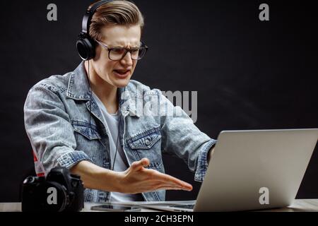 irritated young still man in casual clothes having problems wit Net. side view shot. one of those day. Stock Photo