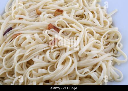 italian spaguetti pasta cooked with garlic and oil Stock Photo