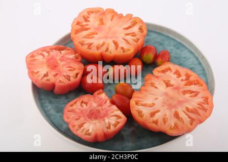 sliced and cherry tomatoes Stock Photo