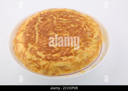 typical spanish omelette with eggs onions and potatoes Stock Photo