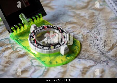 Modern compass placed on map Stock Photo