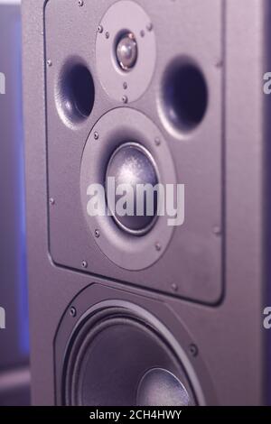 Front panel of the sound speaker system. Selective focus. Stock Photo