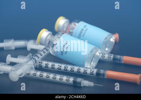Two vials of sample of COVID-19 vaccine on black background. COVID-19 Vaccine or SARS-CoV-2 Vaccine is still in clinical trial phase in 2020. Stock Photo