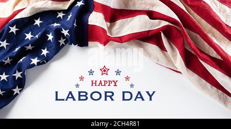 American flags against white background. Flat lay with copy space. Happy Labor Day concept. Stock Photo