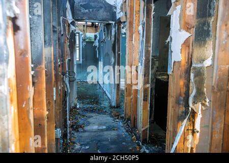 Completely burnt wooden house consequences of fire in California USA Stock Photo