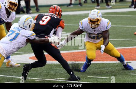 Cincinnati, United States. 13th Sep, 2020. Los Angeles Chargers running  back Austin Ekeler (30) is tackled by Cincinnati Bengals Vonn Bell (24)  during the first half of play at Paul Brown Stadium