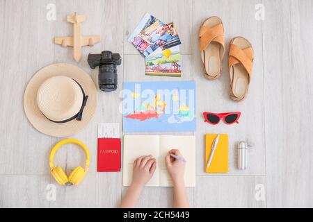 Woman planning vacation, top view Stock Photo