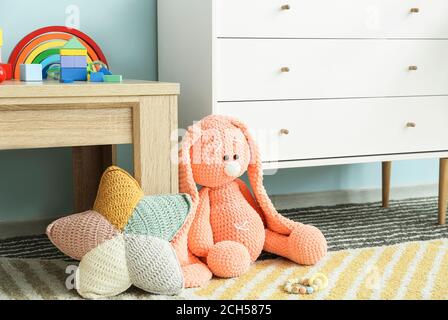 Children's toys on floor in room Stock Photo