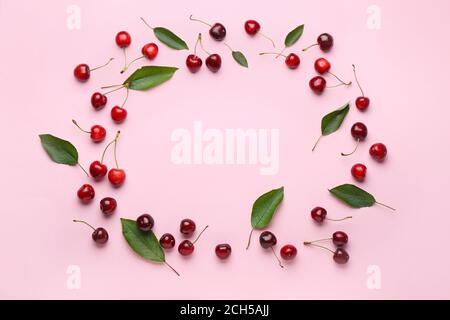 Frame made of ripe sweet cherry on color background Stock Photo