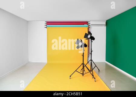 Color backdrops and modern equipment in photo studio Stock Photo