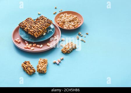 Crispy rice bars on color background Stock Photo