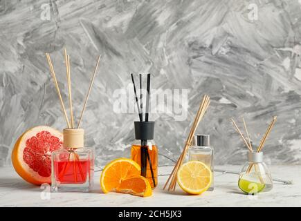 Different reed diffusers on table Stock Photo