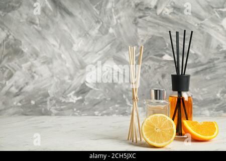 Different reed diffusers on table Stock Photo