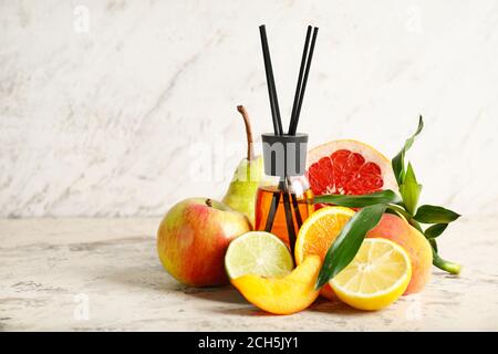 Fruit reed diffuser on table Stock Photo